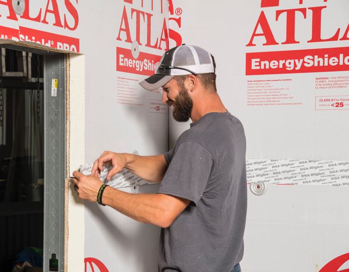 Rushton Sheet Metal Employee installing Atlas products during mock-up wall training.